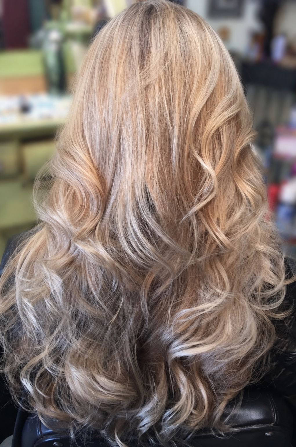 Long, soft blonde waves styled by Kellie at BlueMoon Salon