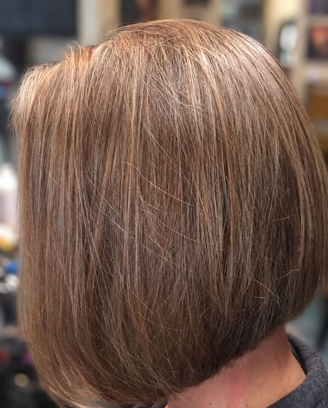 Smooth, rounded brunette bob with subtle highlights, by Kellie