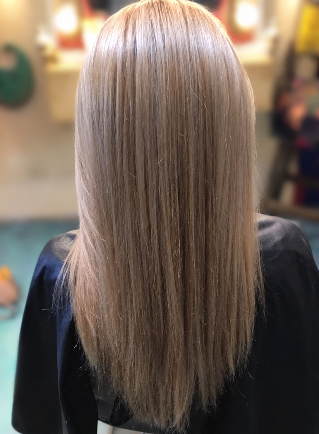 Long, straight cool-blonde hair with a smooth finish, by Kellie